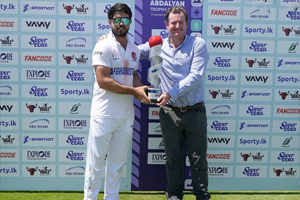 Darwish Rasooli Receives the Winning Trophy