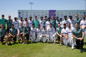 Afghan Abdalyan and the Ireland Wolves pose together for a photo after the match