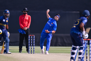 Naveed Zadran charges on during the game against Sri Lanka A