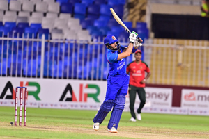 Ibrahim Zadran steps forward to play a gentle lofted straight drive