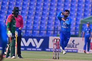 Rashid Khan on his delivery stride during the first ODI against Bangladesh