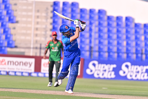 Ibrahim Zadran plays a lofted shot down the ground