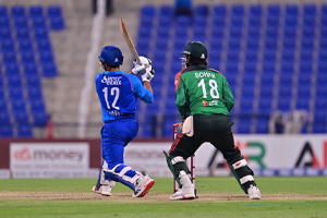 Nangyal Kharoti plays a straight lofted shot in the third ODI
